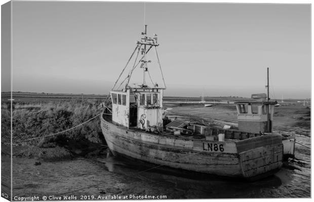 Monochrone fishing boat at Brancaster Staith Canvas Print by Clive Wells