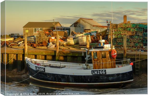 Fishing boat at Brancaster Staith in Norfolk Canvas Print by Clive Wells