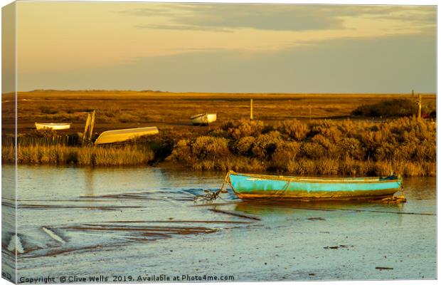 Row boat at Brancaster Staith in North Norfolk Canvas Print by Clive Wells