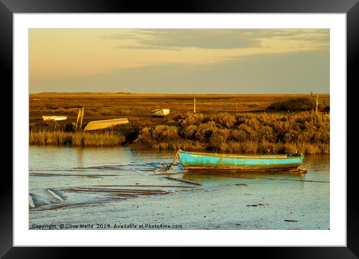 Row boat at Brancaster Staith in North Norfolk Framed Mounted Print by Clive Wells