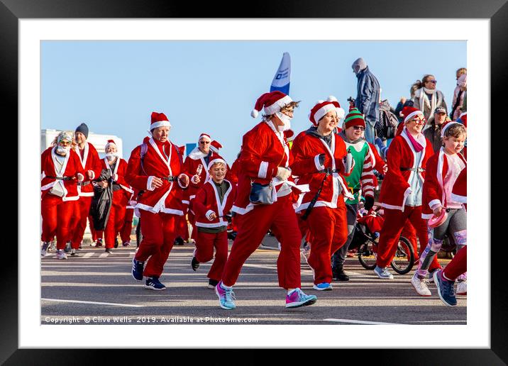 Santa Fun Run Folkstone in Kent Framed Mounted Print by Clive Wells