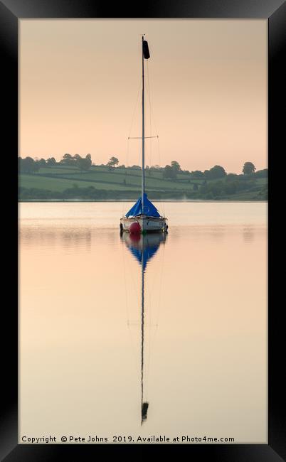 Boat reflecting on lake Framed Print by Pete Johns