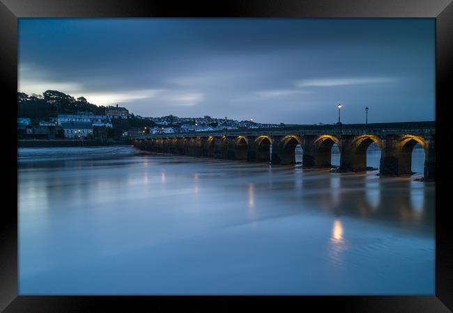 Moody sunrise at Bideford Long Bridge in Devon Framed Print by Tony Twyman