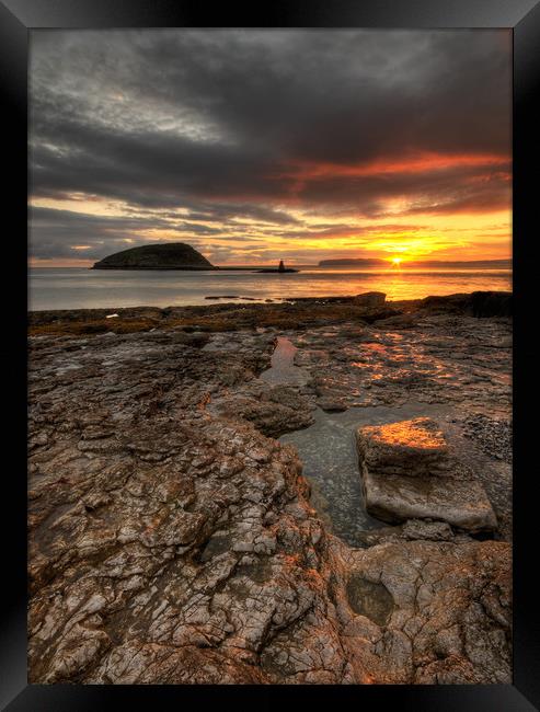 First Rays at Penmon Point, Anglesey Framed Print by Ian Homewood
