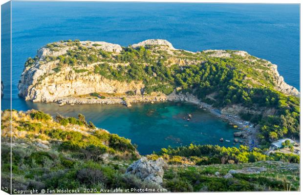 Overlooking Anthony Quinn Bay Canvas Print by Ian Woolcock