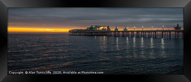 Sunset over the pier Framed Print by Alan Tunnicliffe
