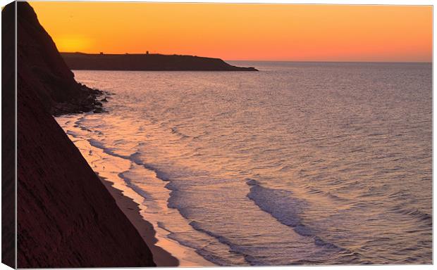 Sunrise over cliffs at Exmouth Canvas Print by Pete Hemington