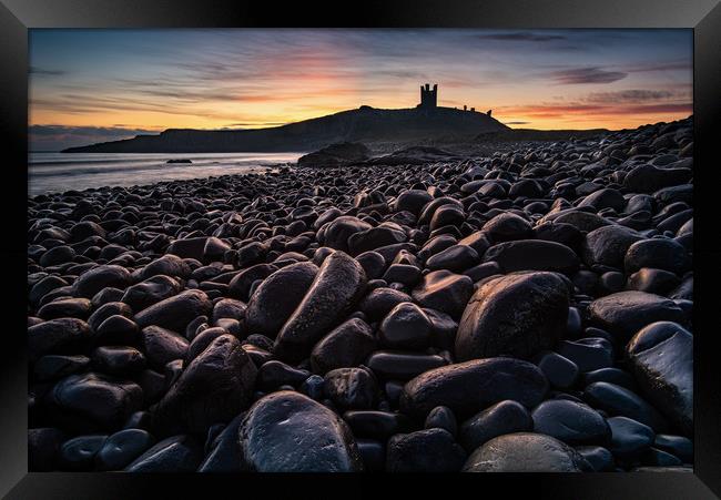 First light on the rocks at Dunstanburgh Castle Framed Print by George Robertson