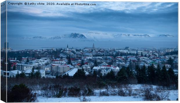 Reykjavik Iceland in the winter with snow  Canvas Print by kathy white