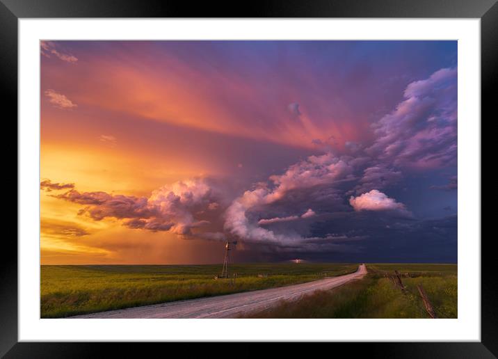 Thunderstorm sunset over Montana Framed Mounted Print by John Finney