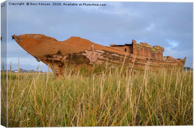 Old Rusty boat through the grasses at Fleetwood Canvas Print by Gary Kenyon