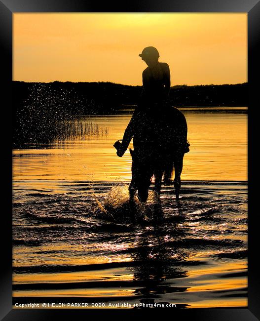 Horse and rider silhouettes at sunset Framed Print by HELEN PARKER