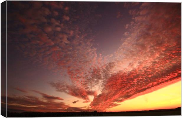 Dramatic  sunrise clouds Canvas Print by Simon Johnson