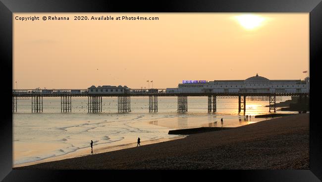 Sunset over Brighton pier Framed Print by Rehanna Neky
