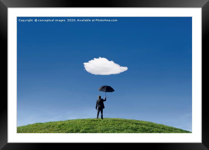 Businessman on a hill holding umbrella  Framed Mounted Print by conceptual images