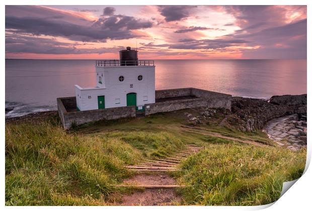 Bamburgh Lighthouse at sunrise Print by Marcia Reay