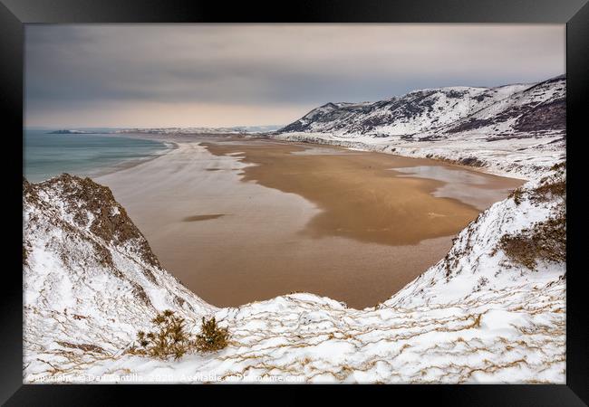 Rhossili Bay in the winter Framed Print by Dan Santillo