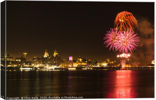 Fireworks over Liverpool waterfront Canvas Print by Clive Wells