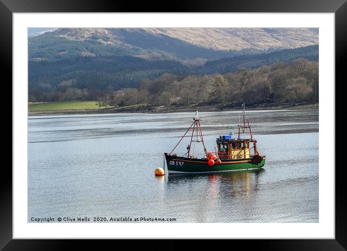 Fishing boat on Loch somewhere in Scotland Framed Mounted Print by Clive Wells
