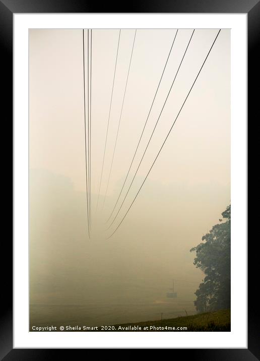 Powerlines disappearing into bushfire smoke Framed Mounted Print by Sheila Smart