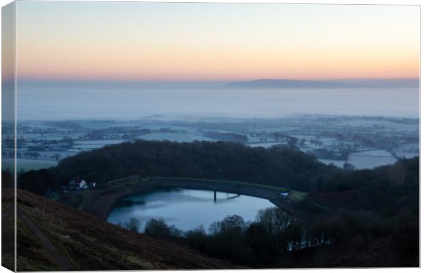 Sunrise from the Iron Age hillfort of British Camp Canvas Print by David Wall