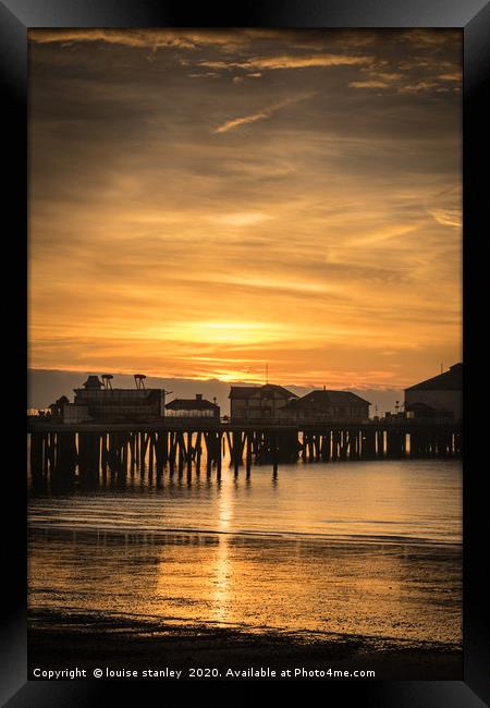 Sunrise over Clacton-on-Sea pier Framed Print by louise stanley