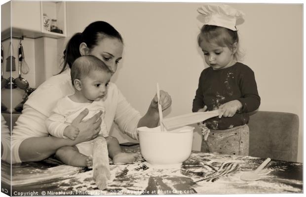 Baker family, Mum with two kids in the kitchen Canvas Print by M. J. Photography
