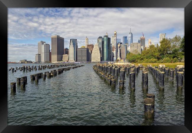 The Manhattan skyline from Brooklyn Park Framed Print by Jon Jones