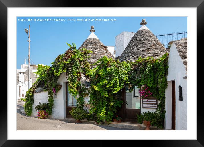 Trulli house in Alberobello Framed Mounted Print by Angus McComiskey