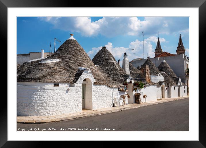 Alberobello trulli houses Framed Mounted Print by Angus McComiskey