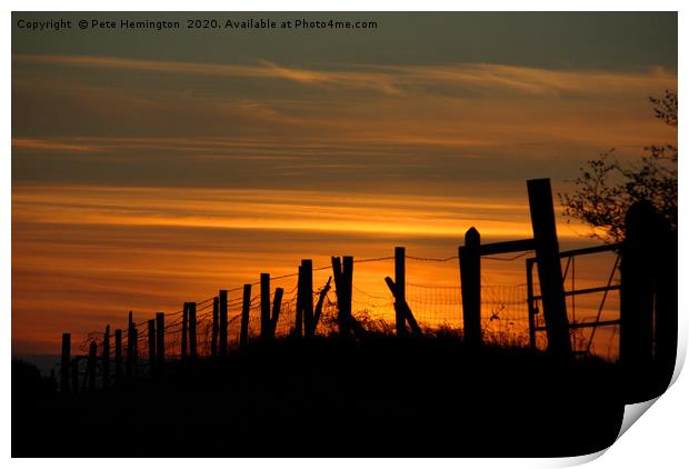 Sunset through the fence Print by Pete Hemington