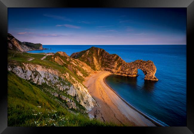 Jurassic coast and Durdle Door in Dorset at sunset Framed Print by Alan Hill