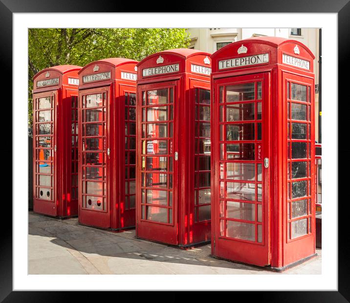Four red telephone boxes in London Framed Mounted Print by Alan Hill