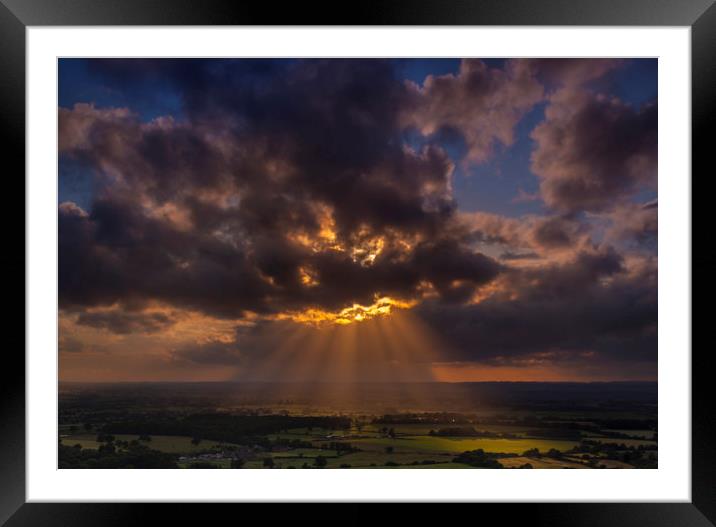 Crepuscular rays of sunlight shine onto fields in Dorset Framed Mounted Print by Alan Hill
