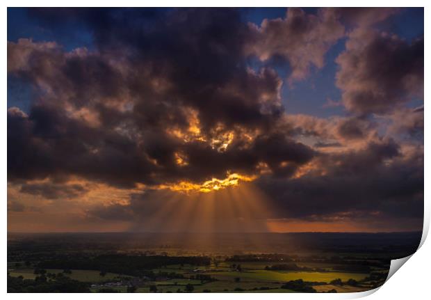 Crepuscular rays of sunlight shine onto fields in Dorset Print by Alan Hill