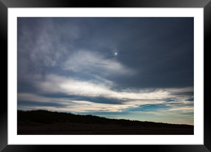 Dark grey clouds with a sun disk. Framed Mounted Print by Alexey Rezvykh