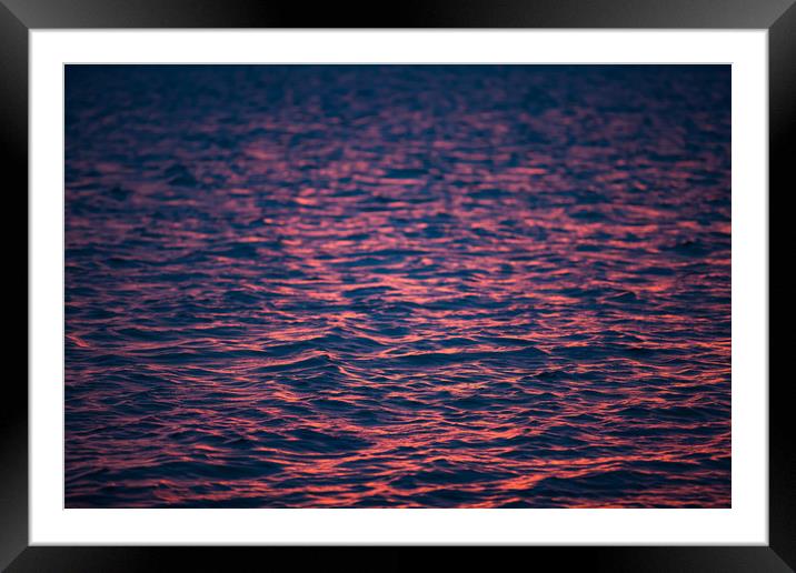 Water ripples in sunset. Framed Mounted Print by Alexey Rezvykh