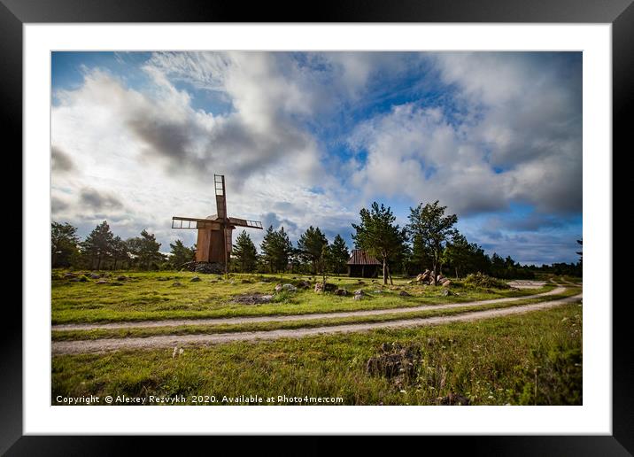 Wooden windmill and rural road. Framed Mounted Print by Alexey Rezvykh