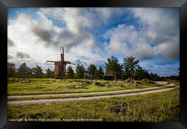 Wooden windmill and rural road. Framed Print by Alexey Rezvykh