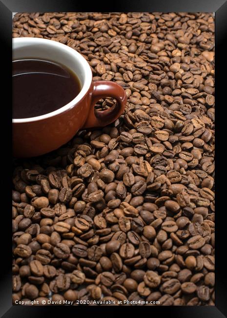 Coffee beans surrounding Coffee cup. Framed Print by David May