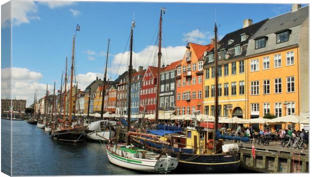 Nyhavn is a 17th-century waterfront, canal and ent Canvas Print by M. J. Photography