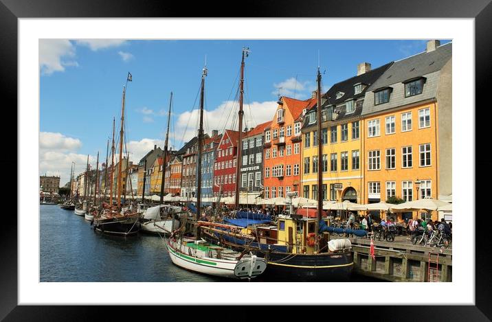 Nyhavn is a 17th-century waterfront, canal and ent Framed Mounted Print by M. J. Photography