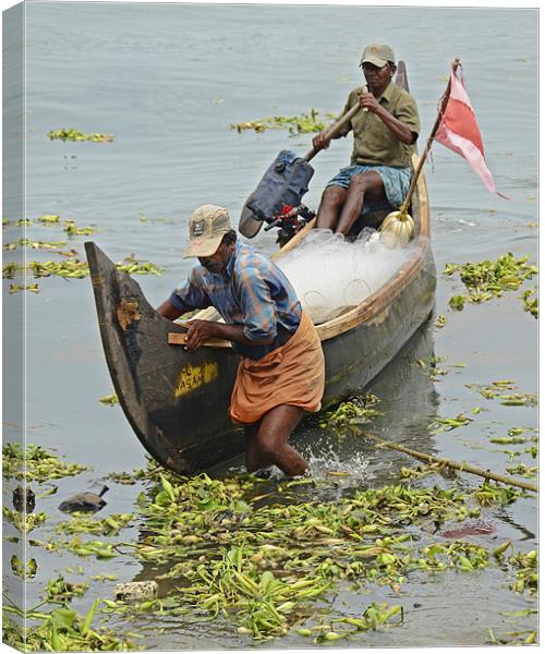 fishermen returns Canvas Print by Hassan Najmy