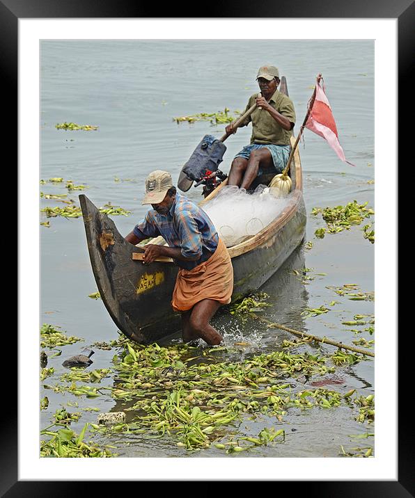 fishermen returns Framed Mounted Print by Hassan Najmy