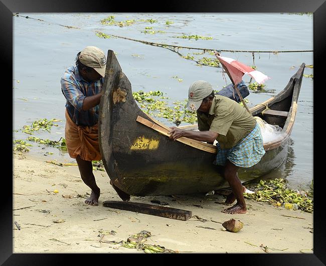 fishermen returns1 Framed Print by Hassan Najmy