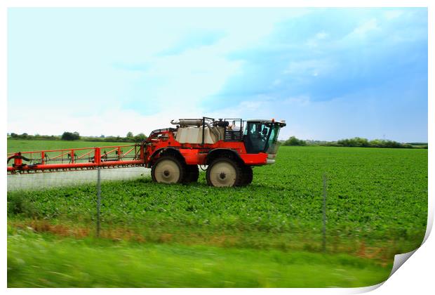Tractor spraying wheat field with sprayer during s Print by M. J. Photography