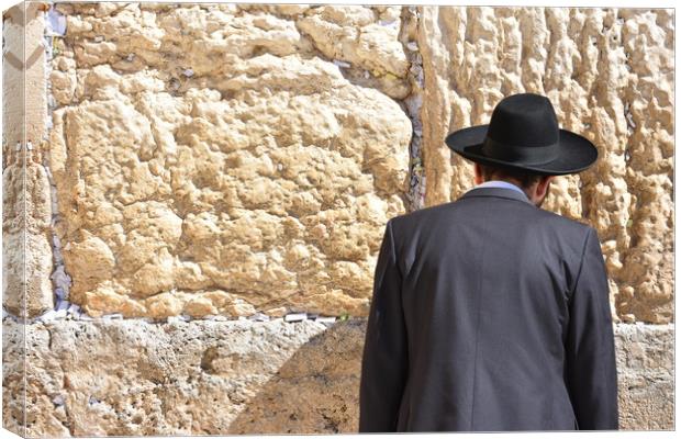 Jew in praying at the Wailing Wall in Jerusalem,  Canvas Print by M. J. Photography
