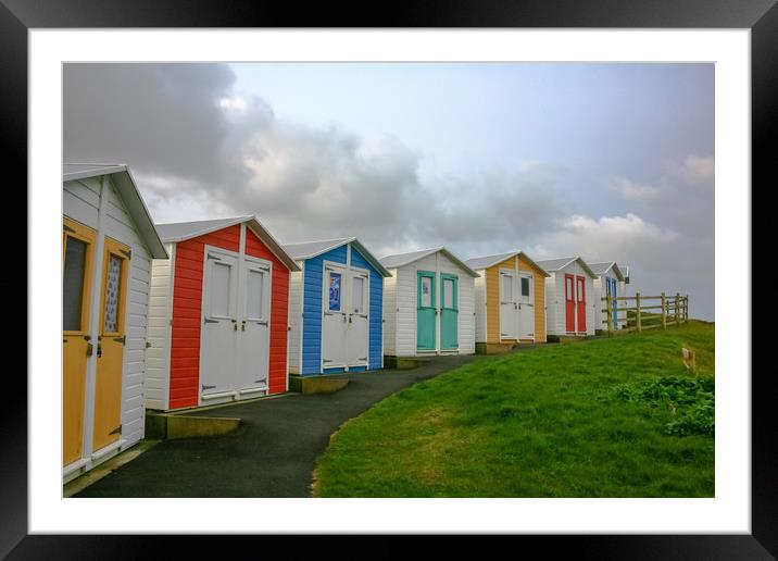 Curving Beach Huts Framed Mounted Print by Dave Bell