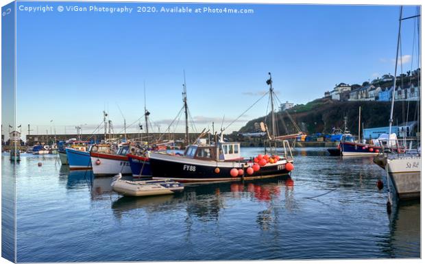 Reflections of fishing boats on Mevagissey Harbour Canvas Print by Gordon Maclaren