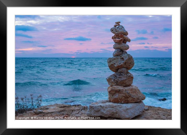 The object of the stones on the beach at sunset.  Framed Mounted Print by Mariya Obidina
